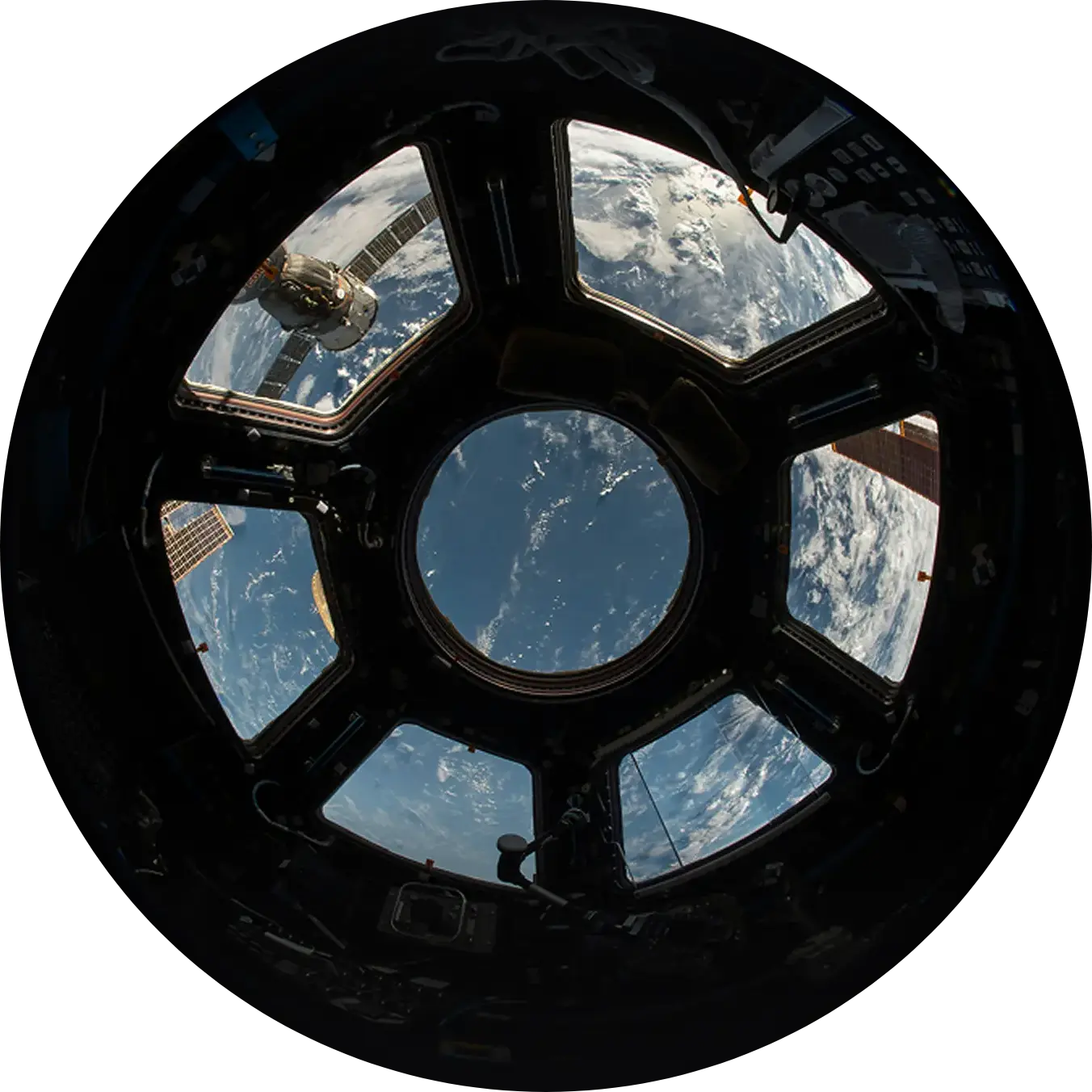 View of the Earth from the cupola of the International Space Station, showing the planet and the stars.